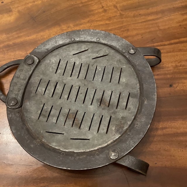 1700s Dutch Strainer, iron with a turned wooden handle with ornate brass straps and a hanging ring. Rose head hand forged...