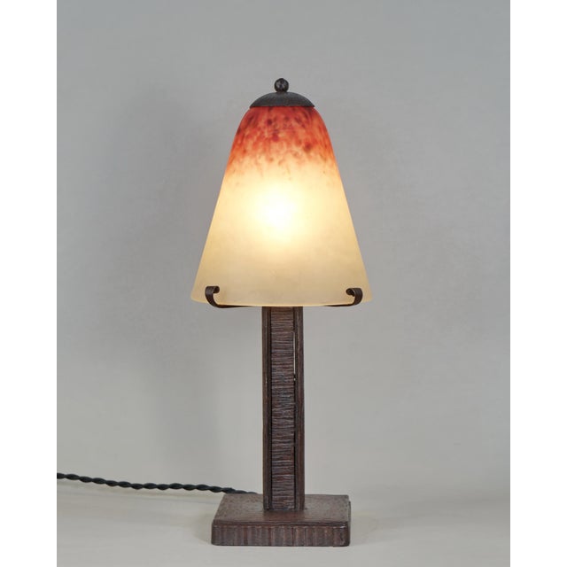 Charles Schneider A wonderful 1925-30 French art deco lamp in wrought iron of excellent quality. The forged base holds a...
