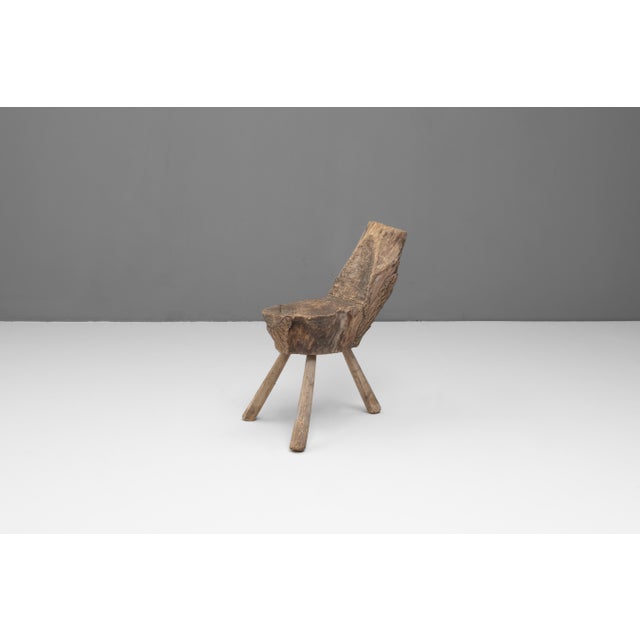 Rough hewn primitive French seat on 3 legs. Circa 1850.