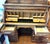 This is a spectacular, walnut roll top desk which is very functional with its five drawers on the lower half, two Birdseye...