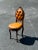 I could only find 1 of these chairs with different upholstery that sold. It said that it was Italian but there is no...