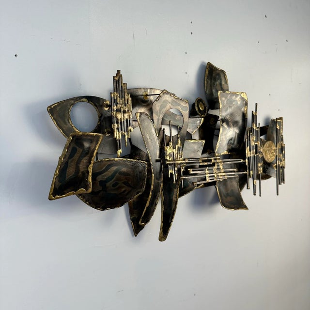 Metal wall sculpture made by Pittsburgh artist Maggie Milano circa 60s constructed out of various metals and brass welded...