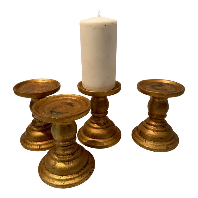 Set of Four Candle Holders in Gold For Sale