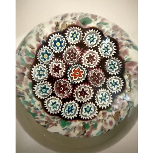 A lovely example of murano glasswork. It has a colorful pastel confetti base with blue and burgundy flowers. A nice accent...