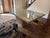 Authentic C.I.M Italian Marble Table with Custom Glass Top. Warm beige/cream color with natural stone patterns and vines....