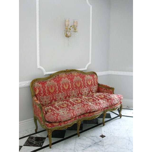 This extraordinary antique Louis the XIV revival sofa is in its original form. It features hand carved frame with gilded...