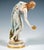 Extremely decorative, fully sculptural representation of an art nouveau beauty in a softly falling robe, tilted forward to...