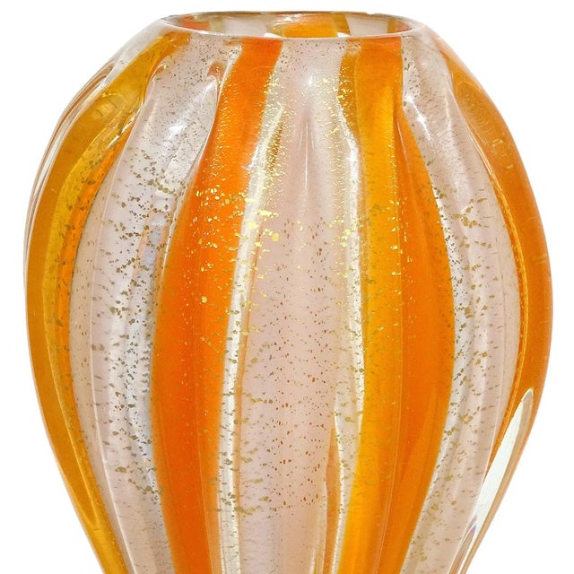 Beautiful, vintage Murano hand blown orange and white stripes, with gold flecks, Italian art glass flower vase. Attributed...