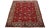 This Vintage Rug has a red field with multicolor accents all over the design. This rug measures 10'2" x 13'.