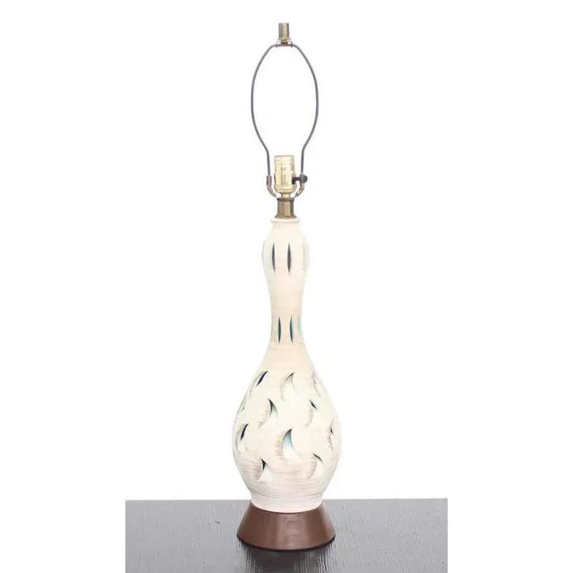 Nice pierced pottery table lamp. Perfect for a mid-century style home.