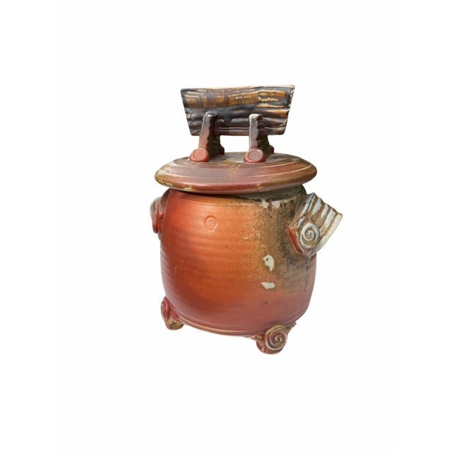 Vintage studio pottery by Oregon potter Mark Heimann. This distinctive covered jar features a rounded cylindrical form...