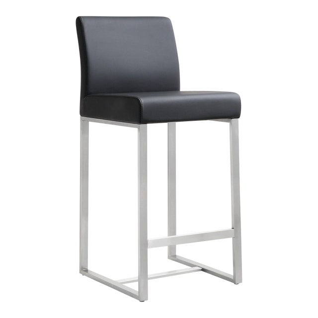 Furnish your kitchen or bar area in contemporary style with the Denmark counter stool from TOV. The solid stainless steel...
