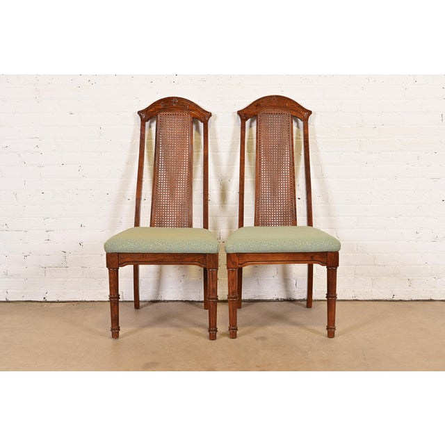 A gorgeous pair of Mid-Century Modern Hollywood Regency Chinoiserie high back side chairs or dining chairs In the manner...
