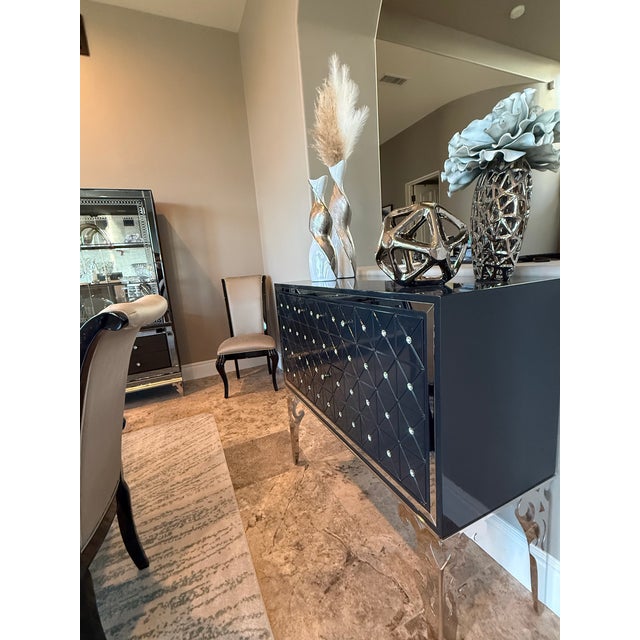 This Hollywood Swank Sideboard was designed by Michael Amini and Jane Seymour, manufactured by AICO. It is a part of a...