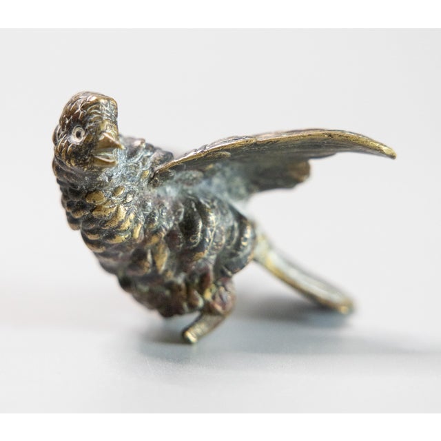 A 19th century antique bird paperweight/hunting trophy in chased patinated bronze. Sourced from a French collector.