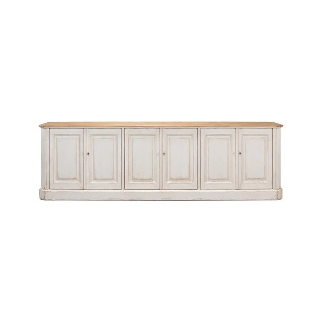 Made with reclaimed pine. The six-door long sideboard buffet is painted in an antiqued rustic whitewash paint and has a...