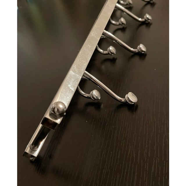 Antique Art Deco Wall Coat hanger with 4 swiveling hooks which rotate flat when not in use. Production period 1940’s in...