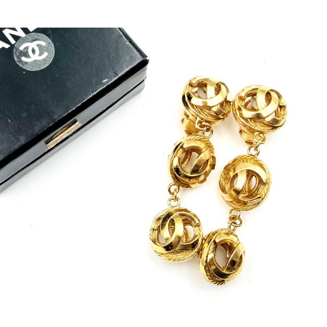 Chanel Vintage Gold Plated CC 3 Ball Dangle Long Clip on Earrings *Marked Chanel *Made in France *Comes with the original...