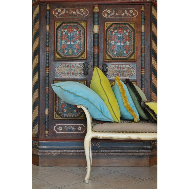 The Happy Frame pillow in green and light green is part of a collection from Lo Decor of soft velvet cushions with a...