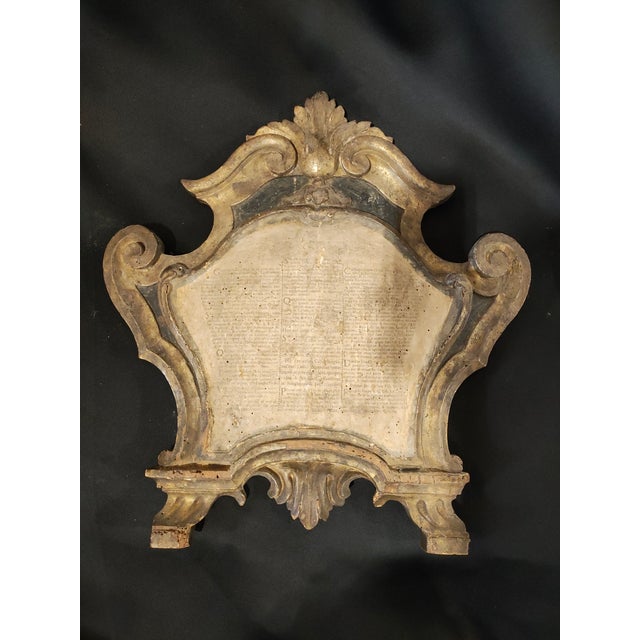 A rare pair of 18th century Italian Baroque altar prayer tablets, carved in giltwood with elegant scrolling acanthus...