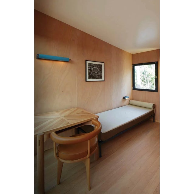 Charlotte Perriand 'Applique Cylindrique Longue' wall lamp in light blue. Perriand's iconic 'Applique Cylindrique'...