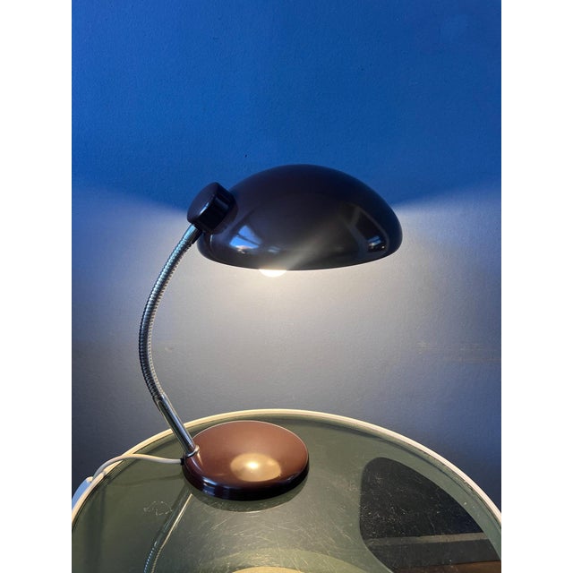 Vintage massive mid-century desk lamp in a beautiful brown finish. The adjustable arm and shade can be positioned in...