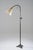 Graceful Swedish floor lamp from the 1940s, crafted in patinated brass. The lamp features a slender adjustable stem with...