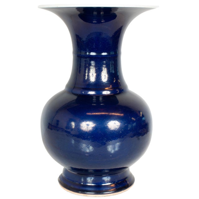 The large globular baluster shaped vase is raised on a stepped flared foot, the body of the vase rises to a trumpet-shaped...