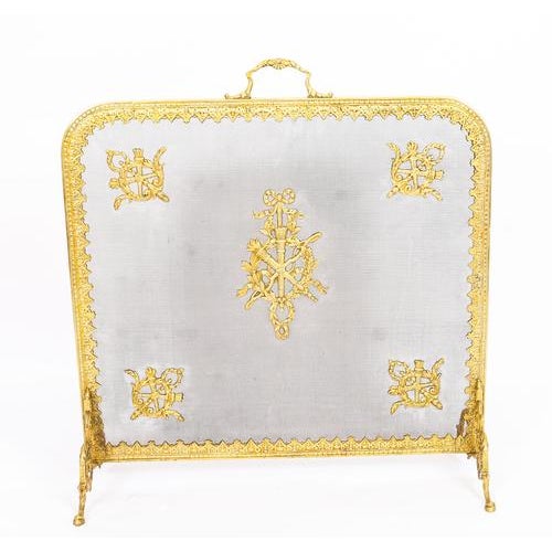 This is a superb and very decorative French Empire revival ormolu and mesh fire-screen, circa 1860 in date. The...