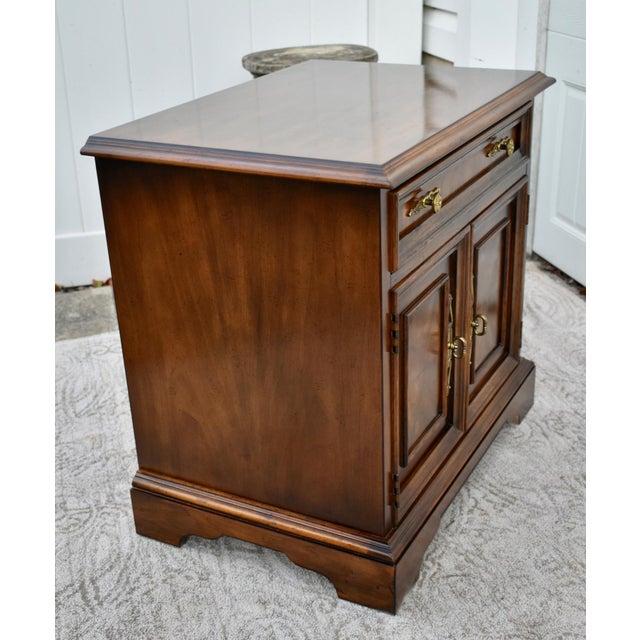 Vintage Nightstand has a Regency Style. Made by Drexel Furniture. The Material is Wood. One Drawer and two Drawers. The...