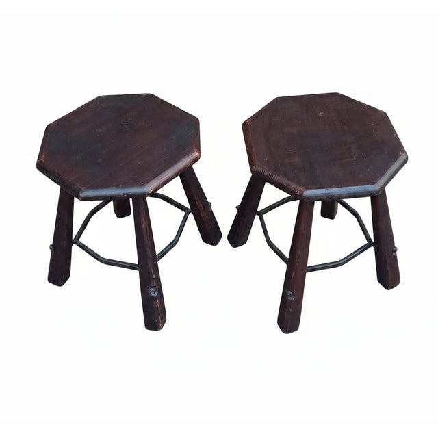Brutalist wooden stools with octagonal seats, faceted legs, and shaped iron legs. Made in Italy in the 1960s/1970s.