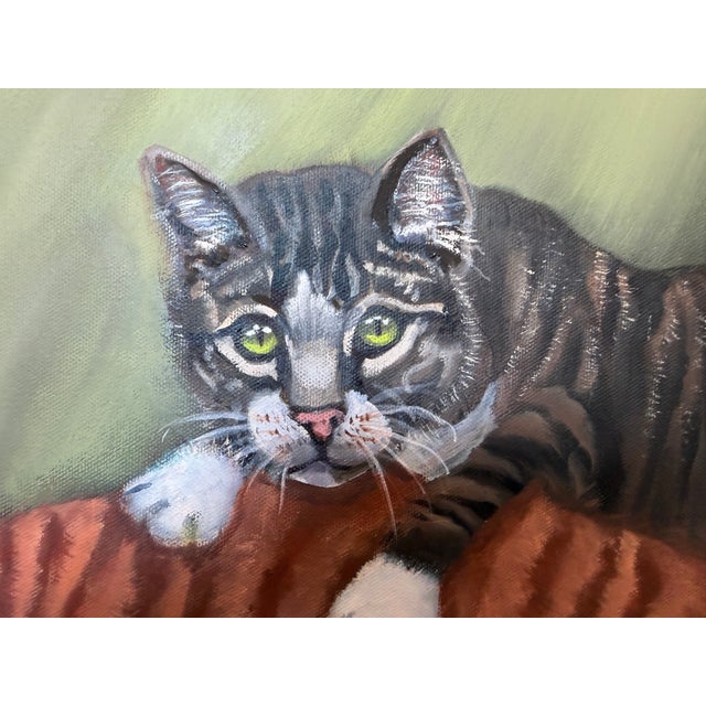 This charming vintage oil painting portrays three beloved cats gathered together in a warm and intimate interior setting....