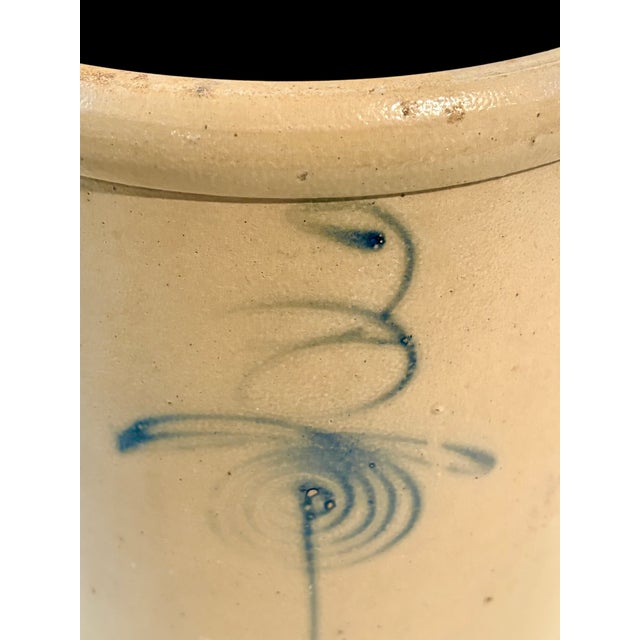 Featured in this listing is an amazing piece of stoneware Americana. It is an antique salt-glazed crock featuring a cobalt...