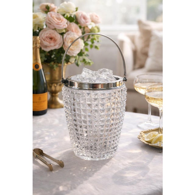 Beautiful vintage cut crystal cocktail ice bucket featuring a deeply faceted diamond pattern and a reinforced starburst...