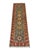 A charcoal gray field sets off the colorful geometric medallions in this natural-dyed wool runner. A deep red border...