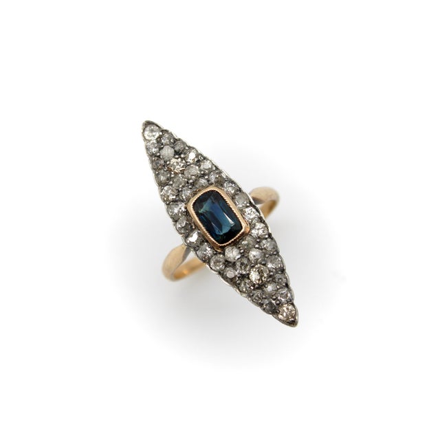 This is a beautiful Early Victorian navette shaped ring featuring Old Mine Cut diamonds and an elongated cushion cut...