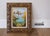 Gorgeous vintage small landscape painting featuring a very picturesque nature scene showcasing high-peaked mountains and a...