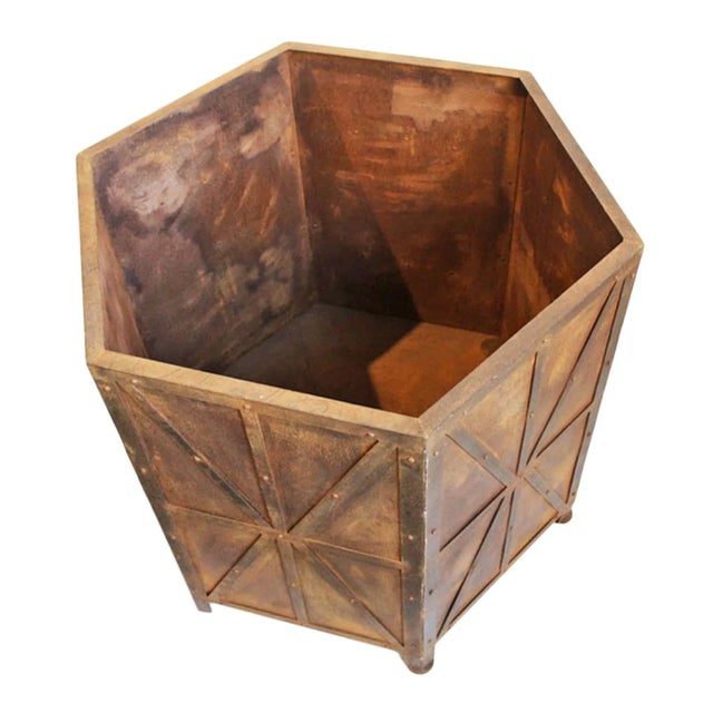 Iron octagon vintage planter box with X design and rivet details. Rusty sealed finish for indoors or out. Opening measures...