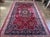 An exquisite oversized Persian Mashhad rug, hand-knotted in the holy city of Mashhad in northeastern Iran. This piece...