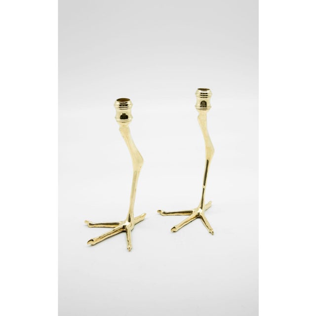 Pair of tall brass candlesticks from Morocco in the form of a bird's leg and claw. Measures: 9 1/2" H.