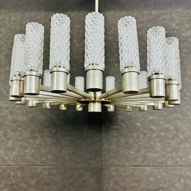 Dimensions: H 31” x W 28” 18 point Vintage Space Age chandelier manner of Hillebrand with cylindrical textured glass...