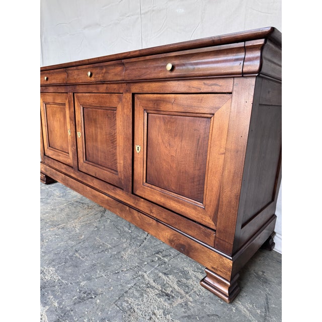 This 19th-century Louis Philippe French server exudes timeless elegance with its ornate craftsmanship and rich walnut...