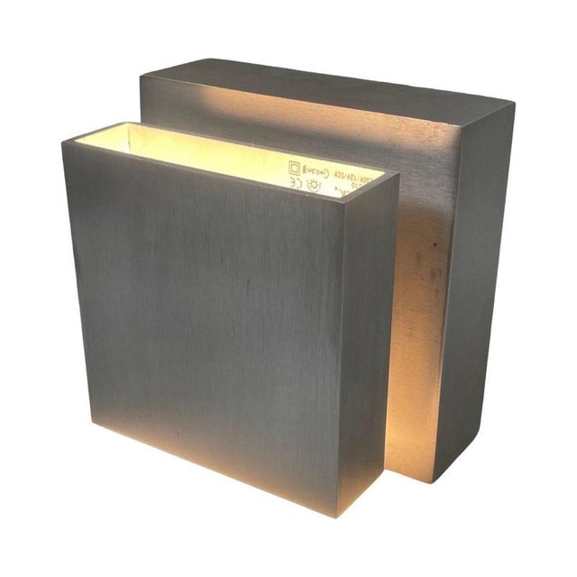 The Scobo Sconce is a up and down light that mounts over a wall or standard J-Box as a square or a diamond shape. The top...