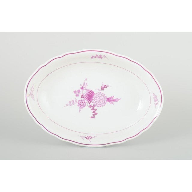 Meissen, Germany Oval bowl, 1930s. Hand-painted oval porcelain bowl decorated with lilac floral compositions and a gently...