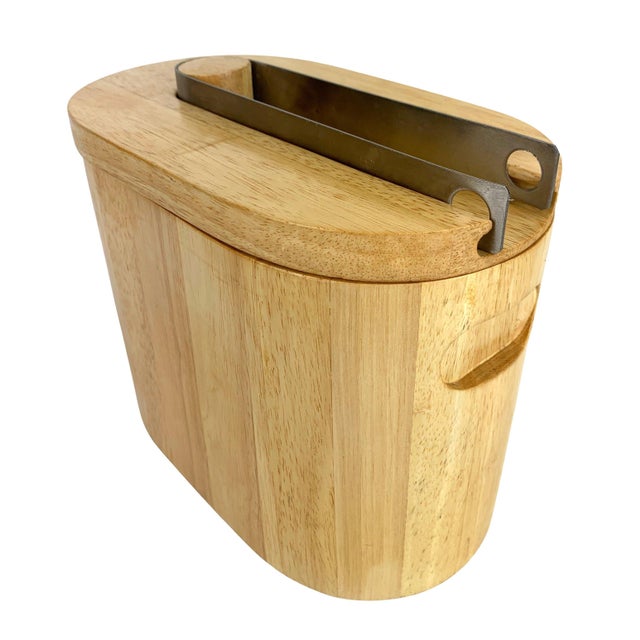 1960-1970s Post-Modernist ice bucket made of blonde teak with a white plastic liner. Ingenious design integrates the steel...