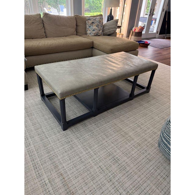 Vanguard Tia Cocktail Ottoman A sophisticated leather cocktail ottoman with nailhead trim around the top. The frame is...