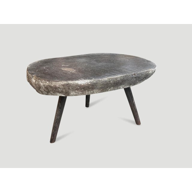 River stone side table from the Ayung River on the island of Bali. We added charred metal legs and polished the top. The...