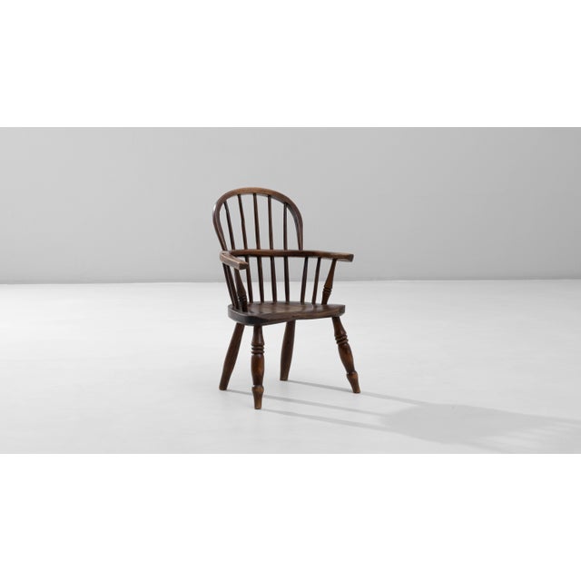 19th Century English Small Spindle-Back Wooden Armchair. This charming, petite armchair reflects the classic craftsmanship...