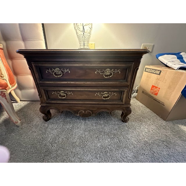 Bring a touch of timeless French elegance to your home with this pair of stunning nightstands from the highly coveted...