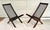 This fantastic pair of vintage folding lounge chairs features a sculptural wood frame with woven black cord seat and back...